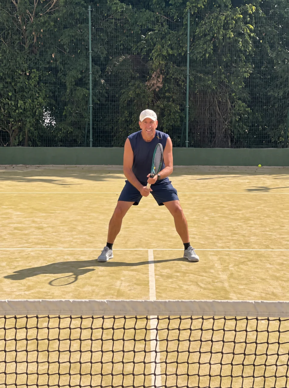 Juan Femenia smiling on the tennis court